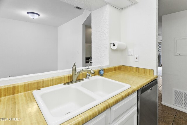 bathroom with tile patterned floors and vanity