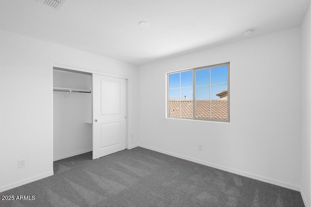 10860 E Tiburon Ave, Mesa, AZ 85212 - unfurnished bedroom with dark colored carpet and a closet
