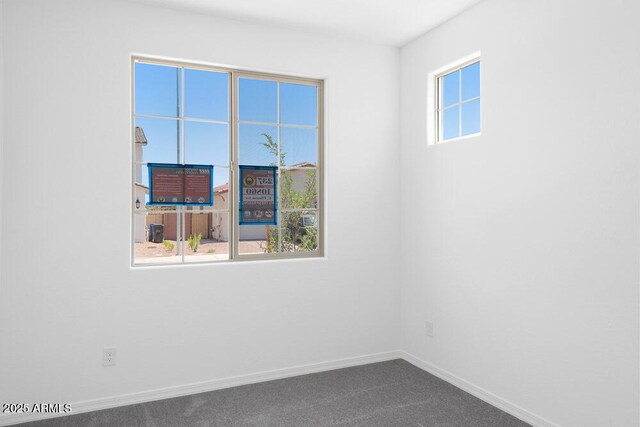 10860 E Tiburon Ave, Mesa, AZ 85212 - spare room featuring baseboards and dark colored carpet