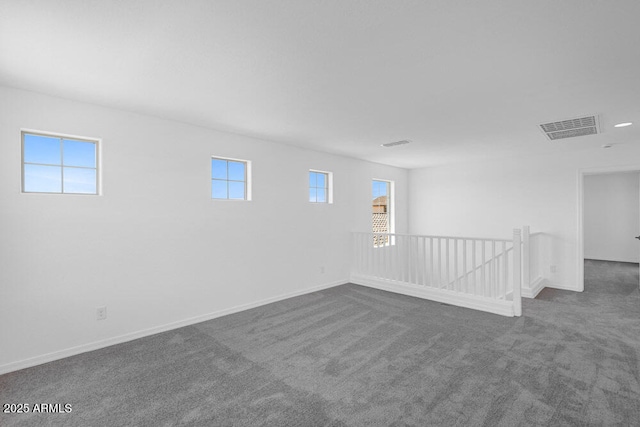 10860 E Tiburon Ave, Mesa, AZ 85212 - spare room featuring dark colored carpet and healthy amount of natural light