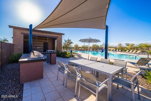10860 E Tiburon Ave, Mesa, AZ 85212 - view of patio / terrace featuring a community pool and outdoor dining area