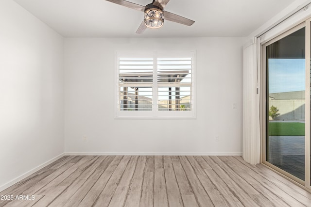 unfurnished room with light wood-type flooring and ceiling fan