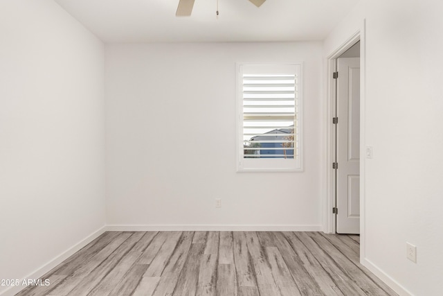 spare room with ceiling fan and light hardwood / wood-style flooring