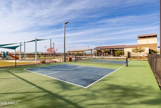 view of sport court featuring a playground