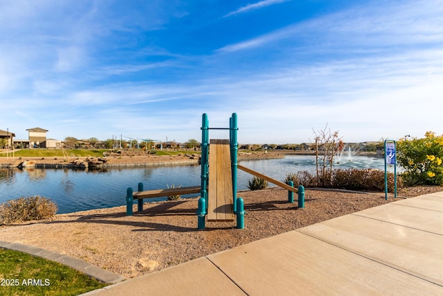 surrounding community featuring a water view