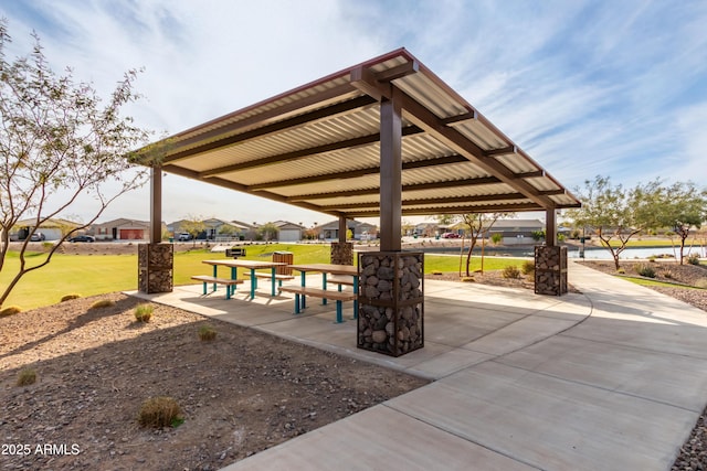 surrounding community with a gazebo and a lawn