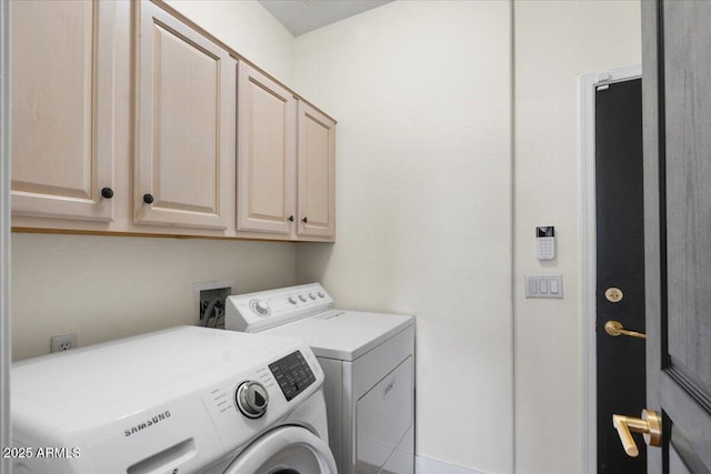 laundry area featuring cabinet space and independent washer and dryer