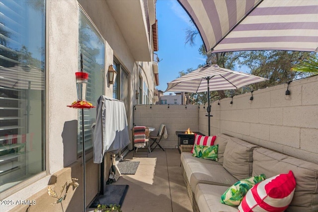 view of patio / terrace featuring an outdoor hangout area and a fenced backyard