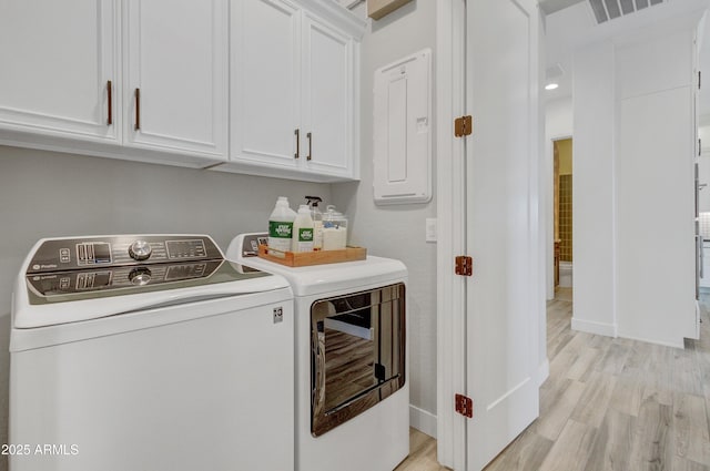 19420 W San Juan Ave, Litchfield Park, AZ 85340 - laundry room with cabinet space, washer and clothes dryer, light wood finished floors, and baseboards