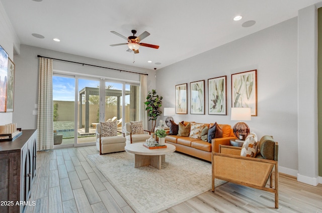 19420 W San Juan Ave, Litchfield Park, AZ 85340 - living area featuring light wood finished floors, a ceiling fan, recessed lighting, and baseboards