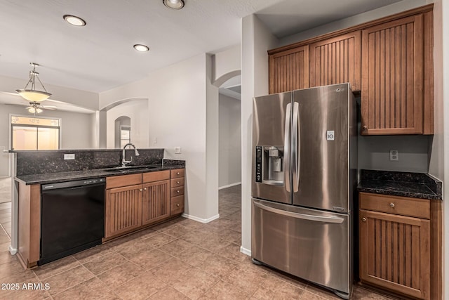 6826 W St Charles Ave, Laveen, AZ 85339 - kitchen with stainless steel fridge, dishwasher, arched walkways, ceiling fan, and a peninsula
