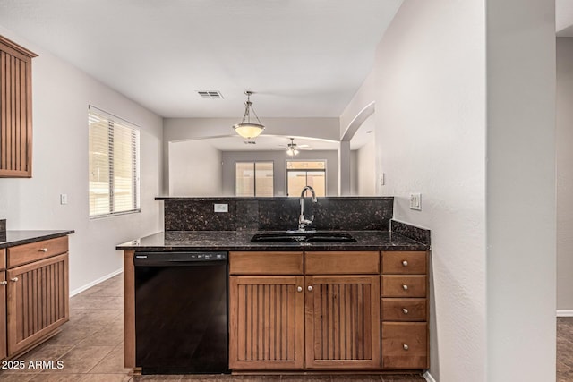 6826 W St Charles Ave, Laveen, AZ 85339 - kitchen featuring dishwasher, ceiling fan, dark stone counters, a peninsula, and decorative light fixtures