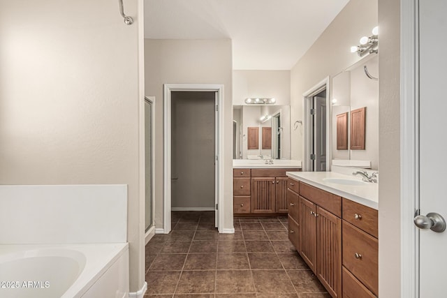 6826 W St Charles Ave, Laveen, AZ 85339 - bathroom featuring a stall shower, a garden tub, two vanities, and tile patterned flooring