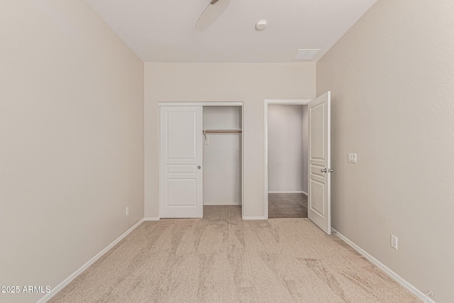 6826 W St Charles Ave, Laveen, AZ 85339 - unfurnished bedroom with carpet floors, a closet, and a ceiling fan