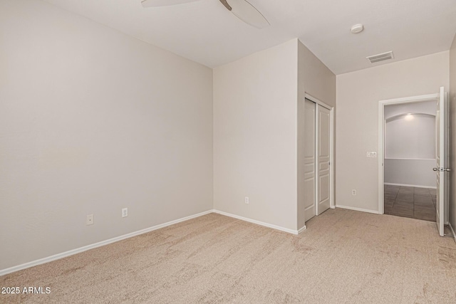 6826 W St Charles Ave, Laveen, AZ 85339 - unfurnished bedroom with carpet floors, a closet, and a ceiling fan
