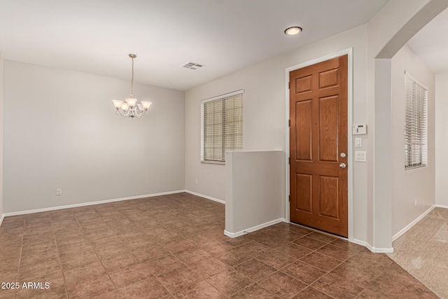 6826 W St Charles Ave, Laveen, AZ 85339 - entryway with arched walkways, a chandelier, and recessed lighting