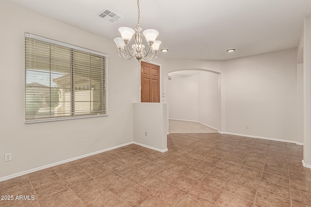 6826 W St Charles Ave, Laveen, AZ 85339 - empty room featuring arched walkways, a chandelier, and recessed lighting
