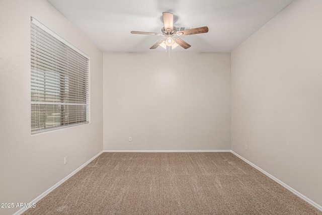 6826 W St Charles Ave, Laveen, AZ 85339 - carpeted spare room with ceiling fan and baseboards