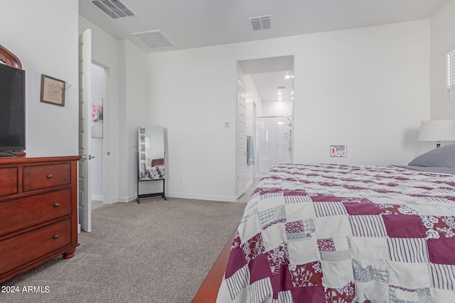 carpeted bedroom featuring connected bathroom