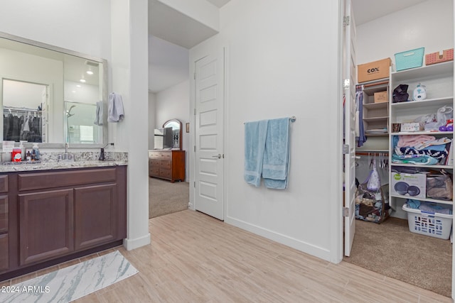 bathroom featuring vanity and wood-type flooring