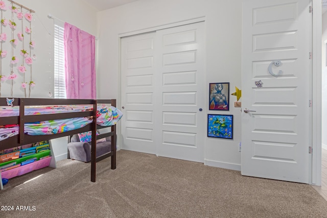 bedroom with a closet and carpet