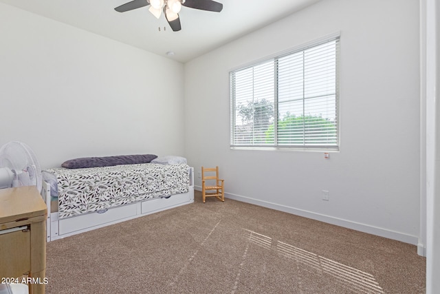 carpeted bedroom with ceiling fan