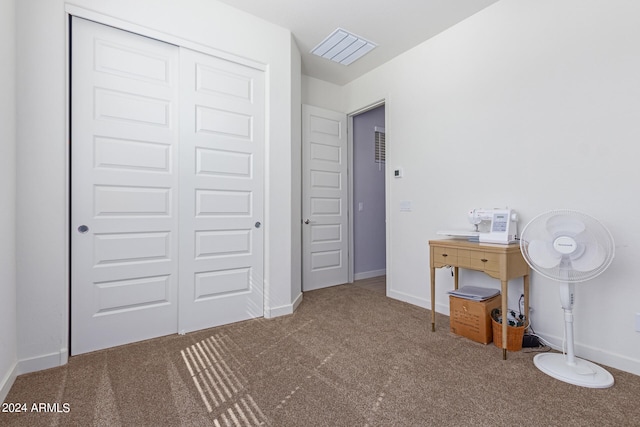 unfurnished bedroom featuring carpet flooring and a closet