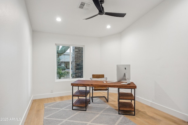 office space with hardwood / wood-style floors and ceiling fan