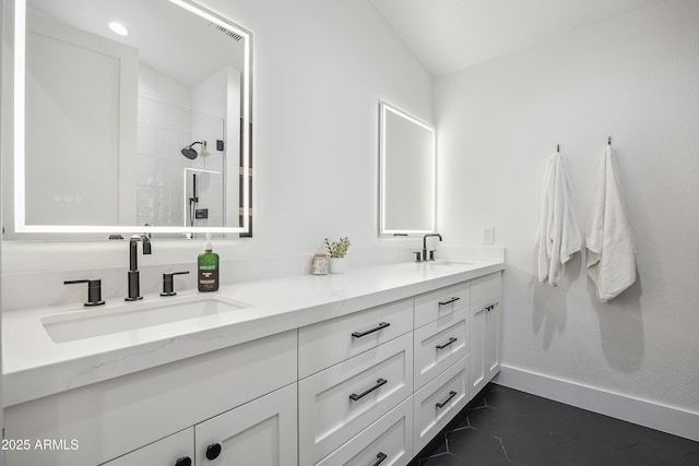 bathroom featuring vanity, tile patterned floors, and a shower