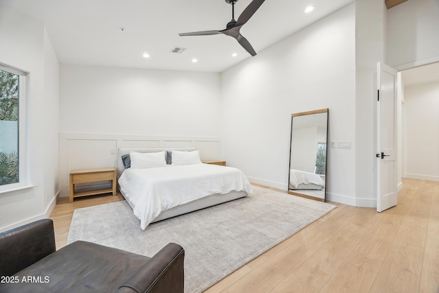 bedroom with ceiling fan and light wood-type flooring