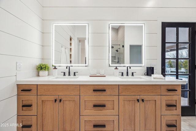 bathroom featuring vanity and a shower