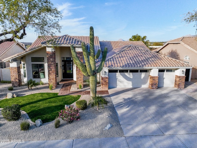 view of front of property with a garage and a front lawn