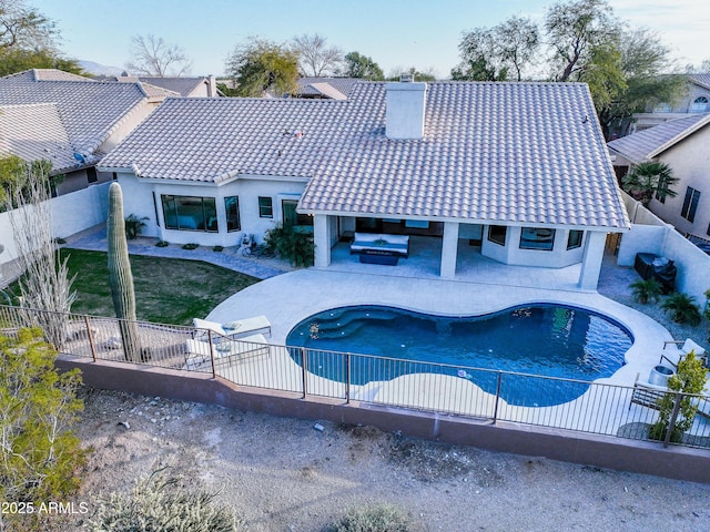 view of pool featuring a grill, a patio area, and an outdoor hangout area