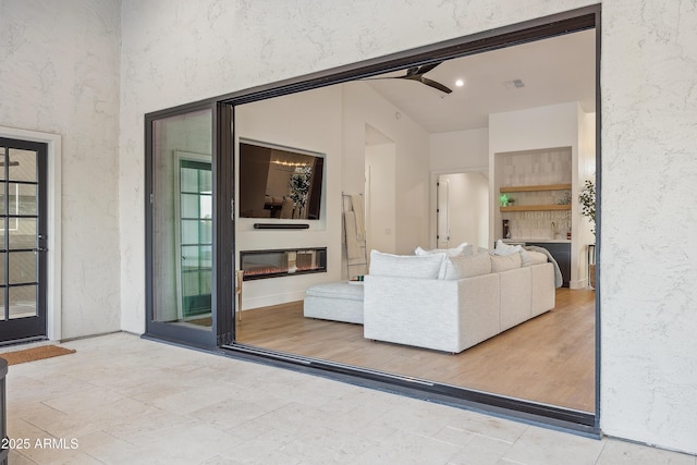 living room featuring ceiling fan