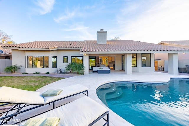 view of pool with an outdoor hangout area, a yard, and a patio area