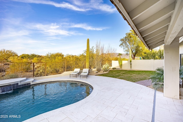 view of pool with pool water feature and a patio area