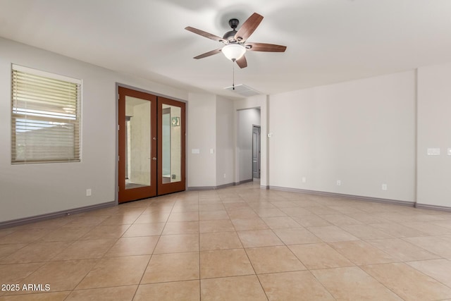 unfurnished room featuring french doors, light tile patterned floors, baseboards, visible vents, and ceiling fan