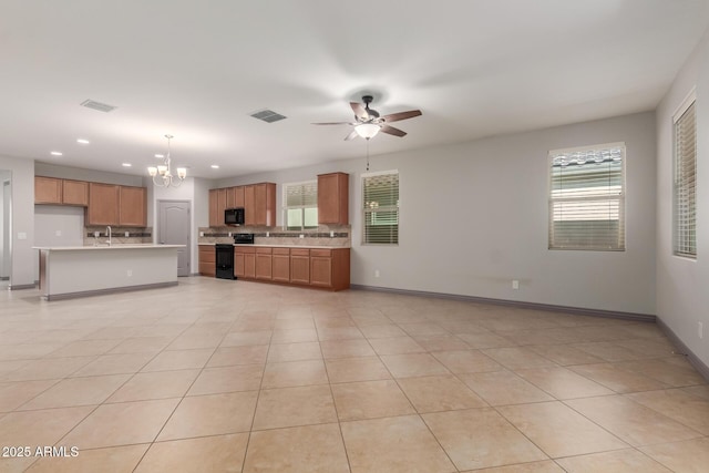 kitchen with ceiling fan with notable chandelier, visible vents, black appliances, and light countertops