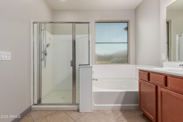 bathroom with a stall shower, tile patterned floors, and a bath