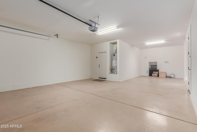 garage featuring a garage door opener and gas water heater
