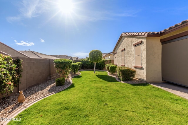 view of yard with a fenced backyard