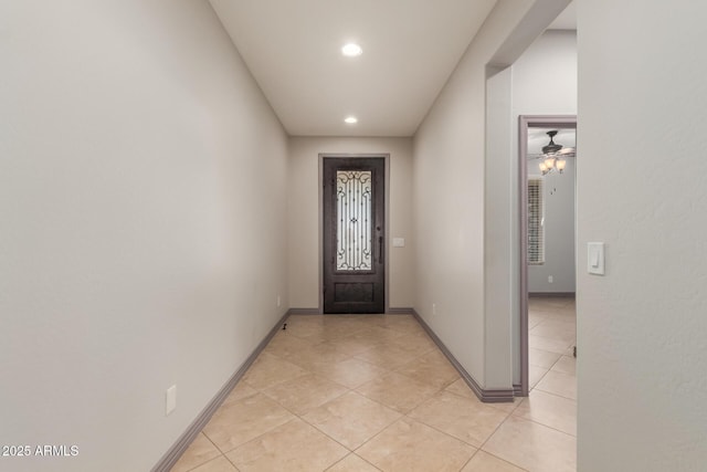 foyer with baseboards, recessed lighting, and light tile patterned floors