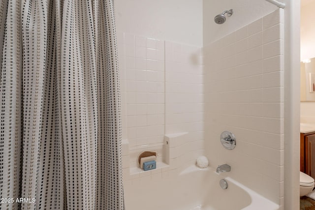 bathroom with toilet, shower / tub combo with curtain, and vanity