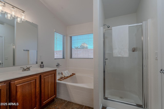 bathroom featuring a shower stall, vanity, a bath, and tile patterned floors