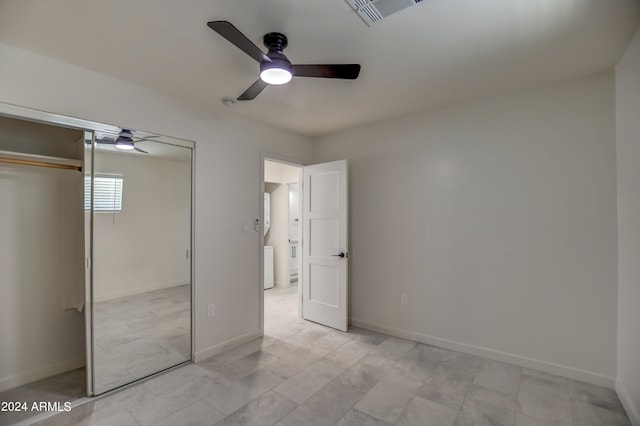 unfurnished bedroom featuring a closet, ceiling fan, and light tile floors