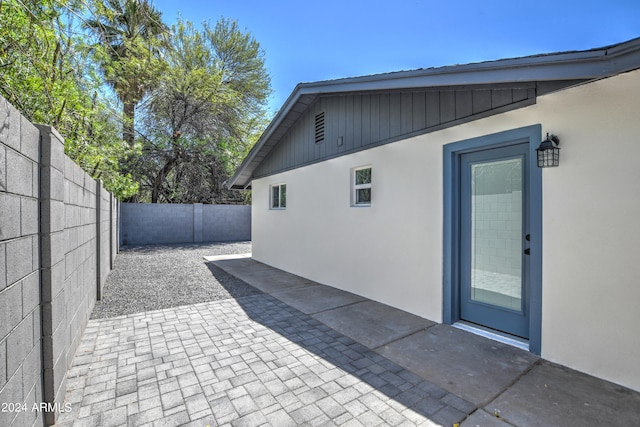 view of property exterior featuring a patio area