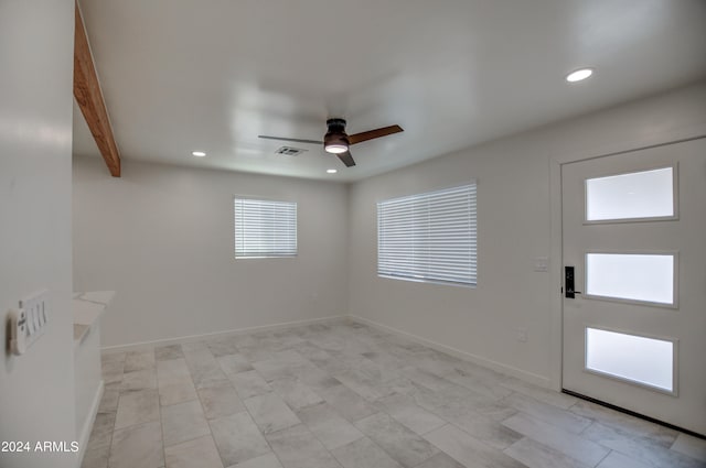 tiled foyer with ceiling fan