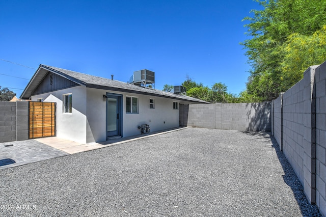 back of house with a patio