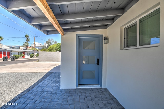 property entrance with a patio area