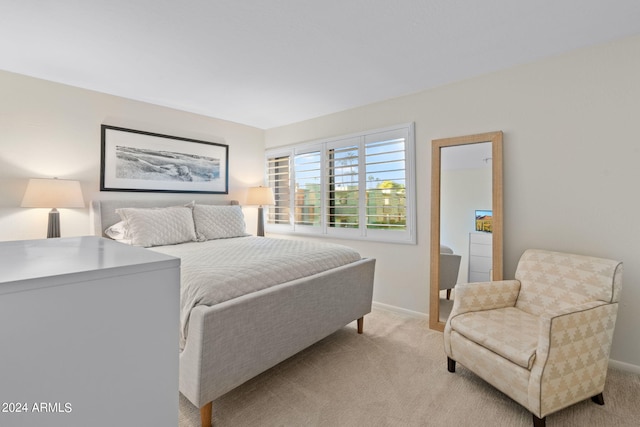 4620 N 68th St Unit 136, Scottsdale, AZ 85251 - bedroom with baseboards and light carpet